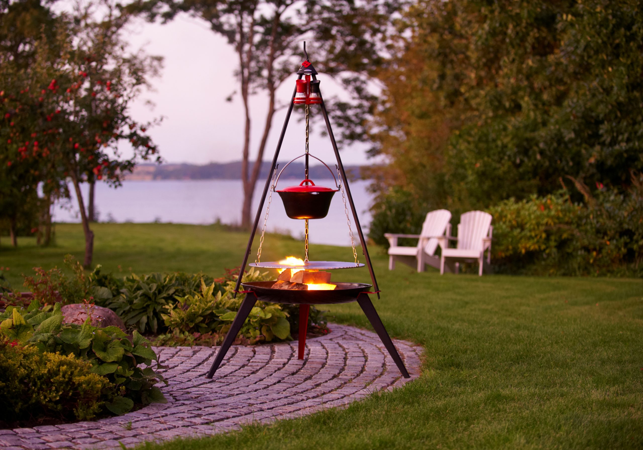 Garden atmosphere - Bon-fire Tripod with Stew pot, Grill grid and Spice rack w. 2 spice mills. Attached to Bon-fire Brazier with long legs.